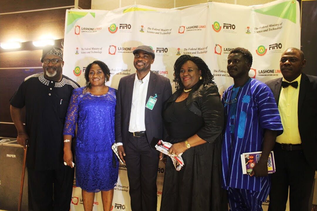Guests posing in front of the FIIRO and Lashone Links backdrop at the launch of The House